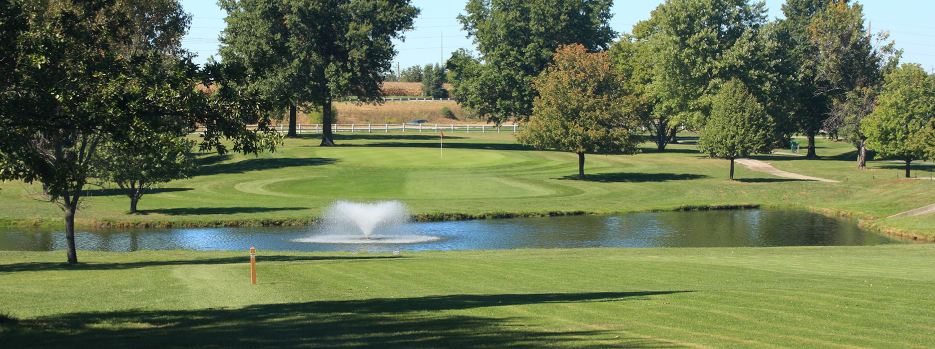 Pristine views at Shamrock Hills Golf Club, capturing the essence of its meticulously maintained course and inviting clubhouse.